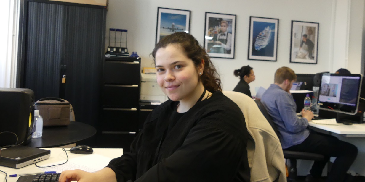 CTH Marketing Assistant, Carla Catasus smiling at her desk in the CTH office in London.
