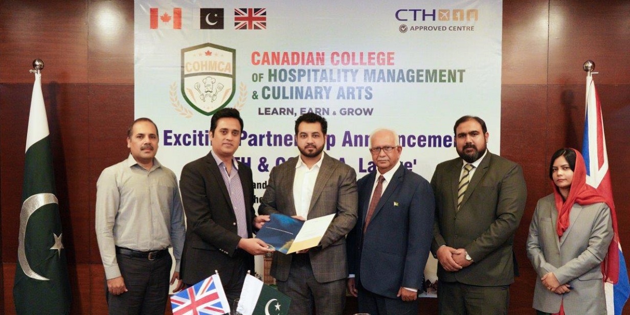 Male and female representatives of Canadian College of Hospitality Management & Culinary Arts (COHMCA) in Pakistan, posing with CTH approval certificate.