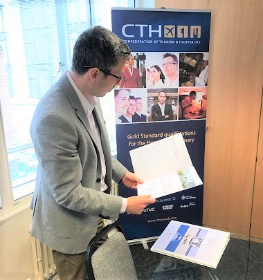 stefano-reading-the-cth-brochure-1