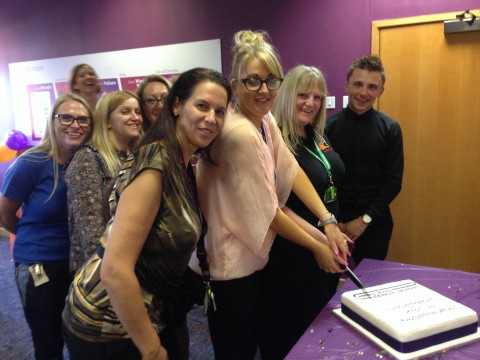 UK Central Reservation Office cutting cake