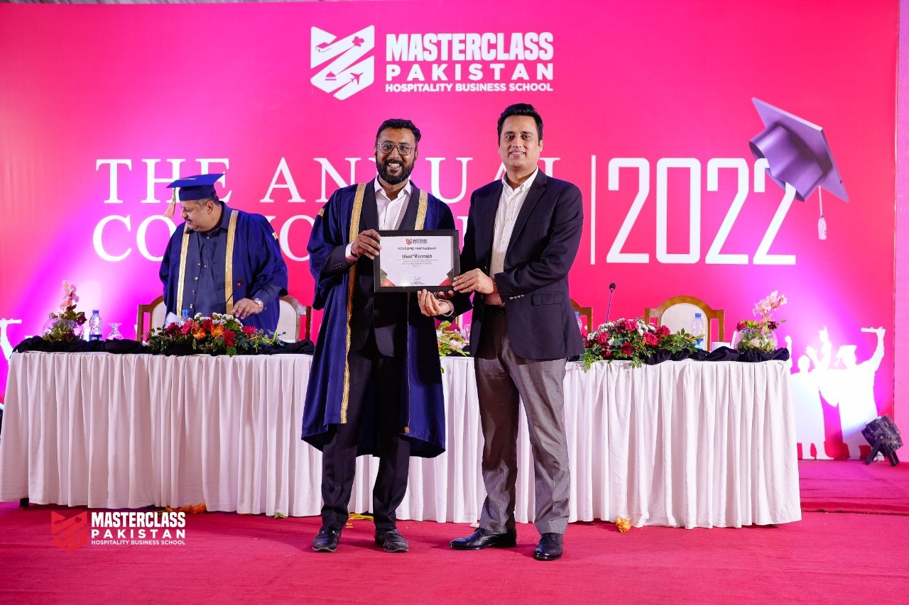 Usama Ahmed and Asad Warraich holding a certificate at the MasterClass Pakistan Annual Convocation 2022.